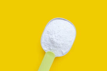 Baking soda on yellow background.