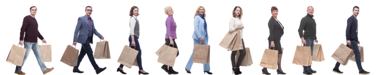 a line of people with shopping bags. side view