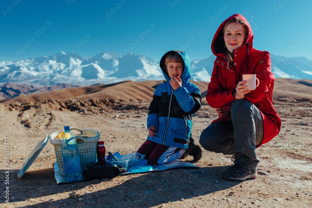 Canvas Prints Mother and son at a picnic in the mountains