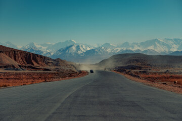 Cars on high mountains road, Kyrgyzstan