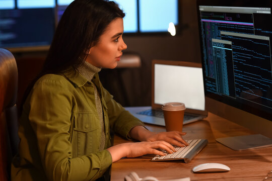 Young female programmer working in office