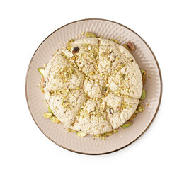 Plate of tasty Tahini halva with pistachios on white background
