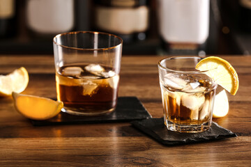 Glasses of cold rum on table in bar