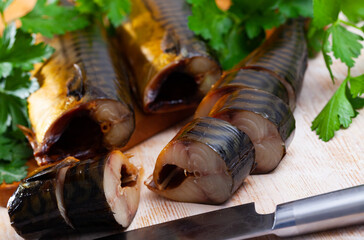 Slices of smoked mackerel served with greens, nobody