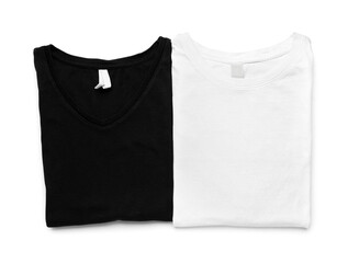 Folded stylish t-shirts on white background