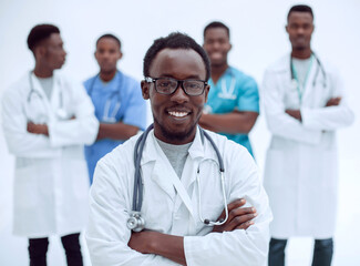 leading medical specialist on the background of his colleagues