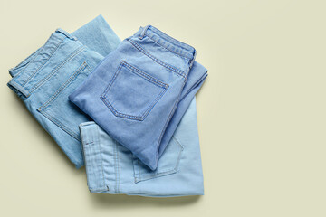 Fototapeta premium Stylish jeans on beige background