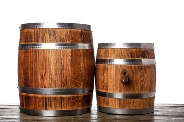 Wooden barrels on table against white background