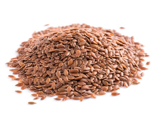 A pile of flax seeds on a white background