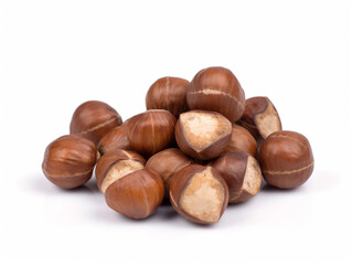 A pile of hazelnuts on a white background