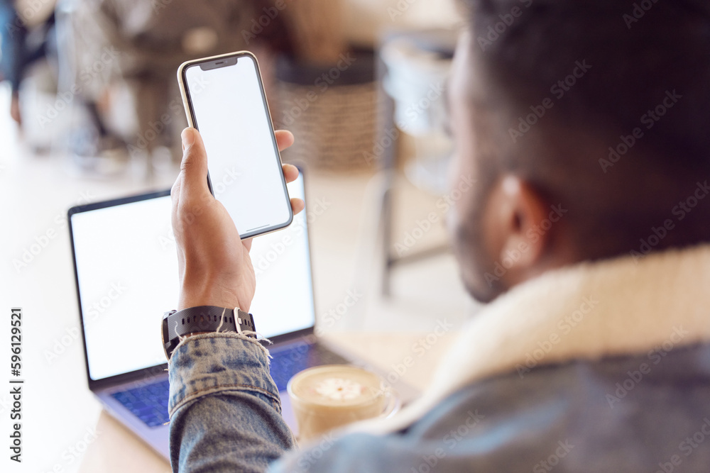 Poster working anytime anywhere that i want. a man using his smartphone and laptop to work in a coffee shop