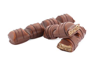 Pieces of tasty chocolate bars on white background