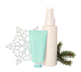 Set of cosmetic products with hand cream and Christmas decor isolated on white. Winter skin care