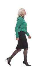 in full growth. woman in a green jumper striding forward.