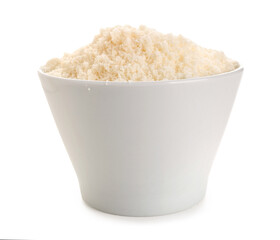 Bowl with tasty grated Parmesan cheese on white background, closeup