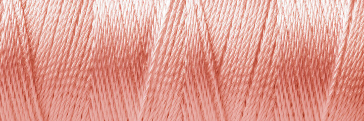 Texture of rose gold thread, closeup view. Banner design