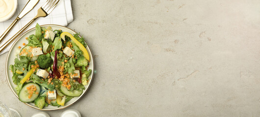 Obraz na płótnie Canvas Delicious salad with lentils, cheese and vegetables served on light grey table, flat lay. Banner design with space for text