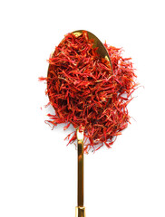 Naklejka premium Spoon with pile of saffron on white background