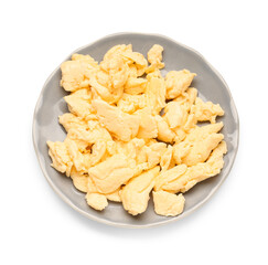 Plate of delicious scrambled eggs isolated on white background