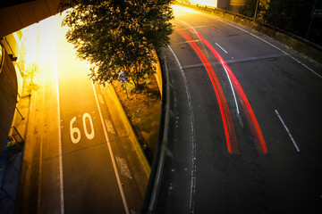 Highway at night with speed limit written on the road - Powered by Adobe