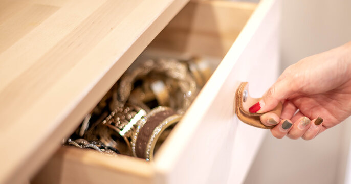 Female Hand-opening Wood Drawer With Leather Handle For Arranging Accessories In The Room.