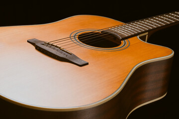 The close-up acoustic guitar