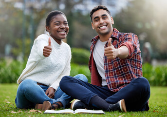 The best study buddy any student could have. a young man and woman showing thumbs up on a study break at college.