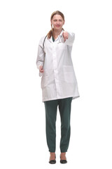 Attractive female doctor standing on white background holding clipboard and doing paperwork