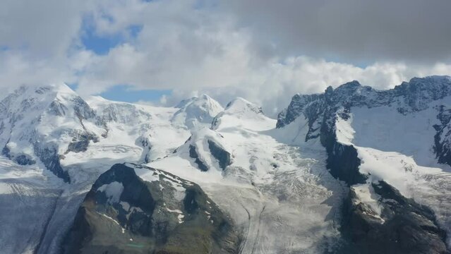 Switzerland. Aerial view of Monte Rosa massif, flanked by glaciers, is the highest mountain in the Swiss Alps. It has ten 4000m peaks. The Dufourspitze on the Monte Rosa massif is the highest peak