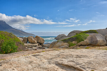Rocky coastline of the Camps Bay, Western Cape. Ocean view - Camps Bay, Table Mountain National Park, Cape Town, South Africa.