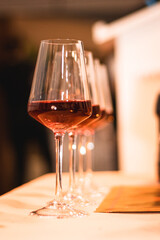 Glasses of wine aligned decoration for easter, communion and passover