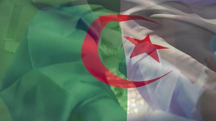 Animation of waving algeria flag over female surgeon tying surgical mask on male surgeon at hospital - Powered by Adobe