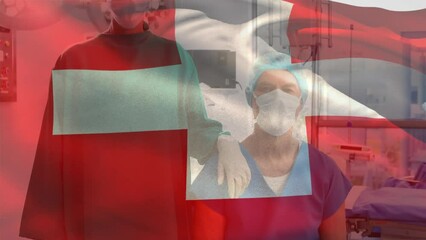 Animation of flag of switzerland over caucasian surgeons with face masks - Powered by Adobe