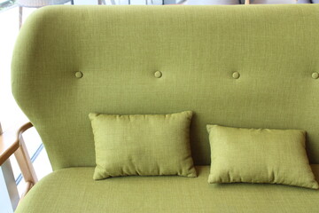 Contemporary green sofa and pillows