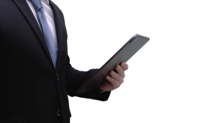 Business man wearing suit holding tablet and reading information cutout from background. Communication over Internet in the Digital world era concept.