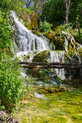 Beautiful Waterfall background in sunny summer day. Beautiful Waterfall In Krka National Park - Croatia, Europe. Krka river waterfalls in the Krka National Park