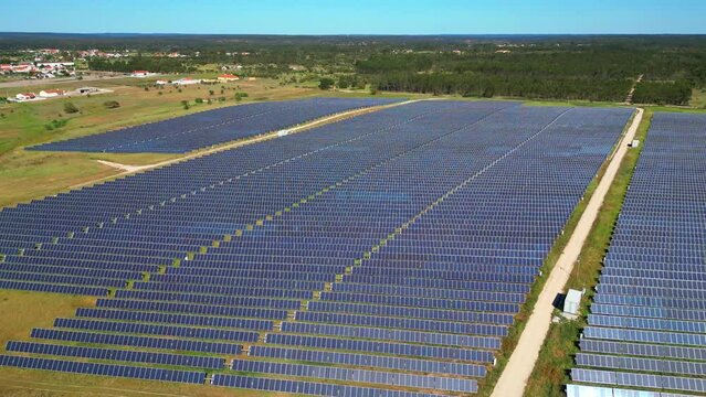 Aerial circular view of a big  photovoltaic cells, absorving solar energy on the field,Portugal.