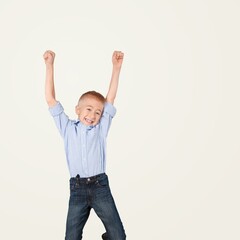 Happy small kid raising hand