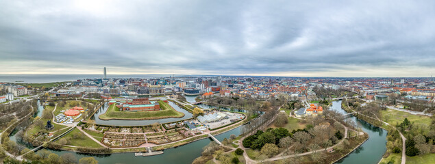 Aerial panorama view of Malmo castle and city with dramatic sunset over the Turning Torso highest building in Scandinavia