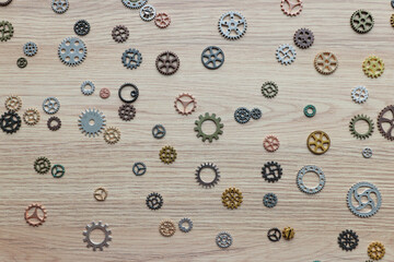 Small gears and cogs representing brain functioning on table