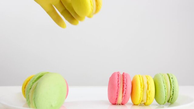 Making macarons. The process of making a french dessert. Macaron macaroon. Food industry, batch or volume production. 4K Video shooting. High quality 4k footage