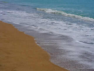 beautiful sea waves and sandy beach