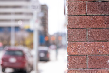 Red brick wall in downtown city street