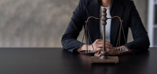 Wide panorama view of lawyer working with contract papers and wooden gavel on tabel in courtroom.  justice and law ,attorney, Law and justice concept.