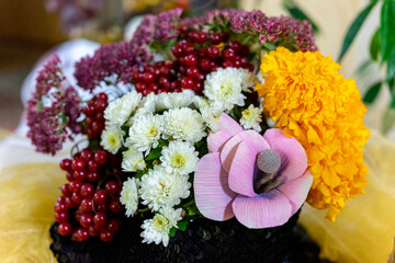 A bouquet of autumn flowers and red viburnum