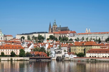 Fototapeta na wymiar Cityscape with cathedral, castle, river and historic palaces along the Vltava river in Prague, Czech republic