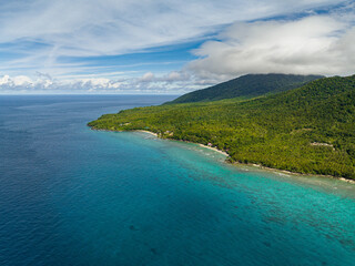 Aerial view of Weh island with jungle and blue sea. Aceh, Indonesia.