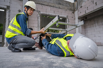 Accidents at work. Asian engineer fell from a height, fell to the ground and was crushed by a...