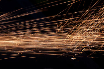 Grinding work with the formation of a plume of sparks