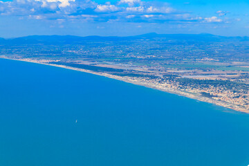 Fototapeta na wymiar View from a flying plane on Fiumicino bay and the Tyrrhenian sea, Italy